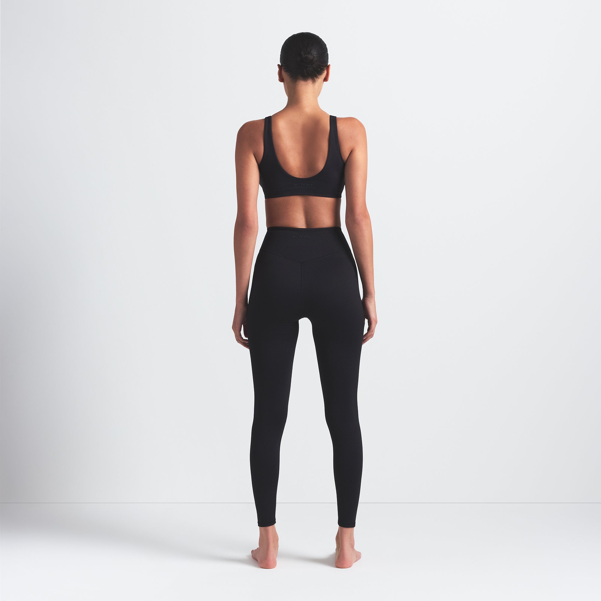 NikeSKIMS MATTE 26" LEGGING | OBSIDIAN ON A MODEL BACK VIEW