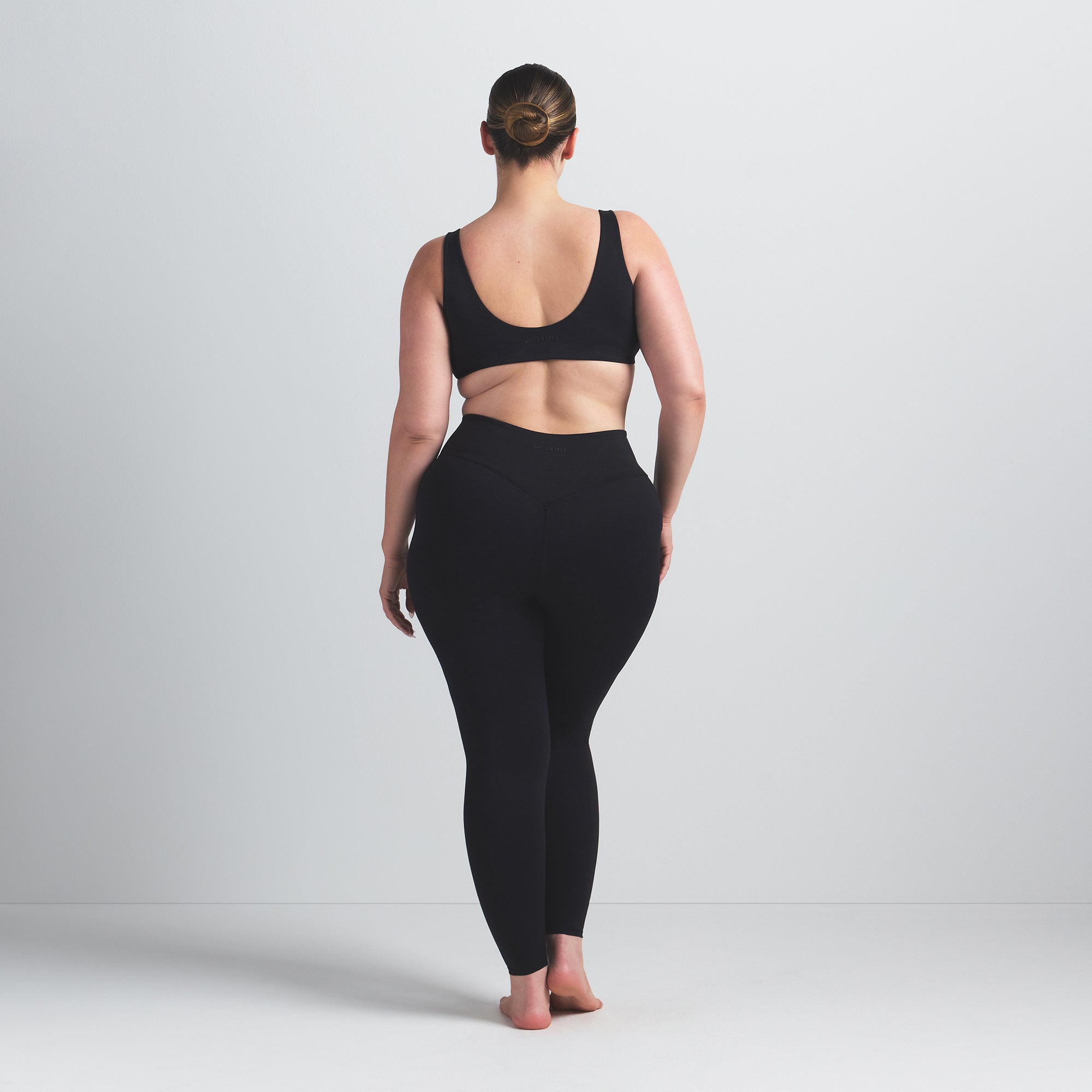 NikeSKIMS MATTE 26" LEGGING | OBSIDIAN ON A MODEL BACK VIEW