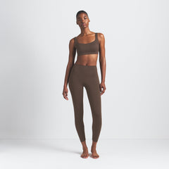 NikeSKIMS MATTE V-LINE 26" LEGGING | DARK SEPIA ON A MODEL FRONT VIEW
