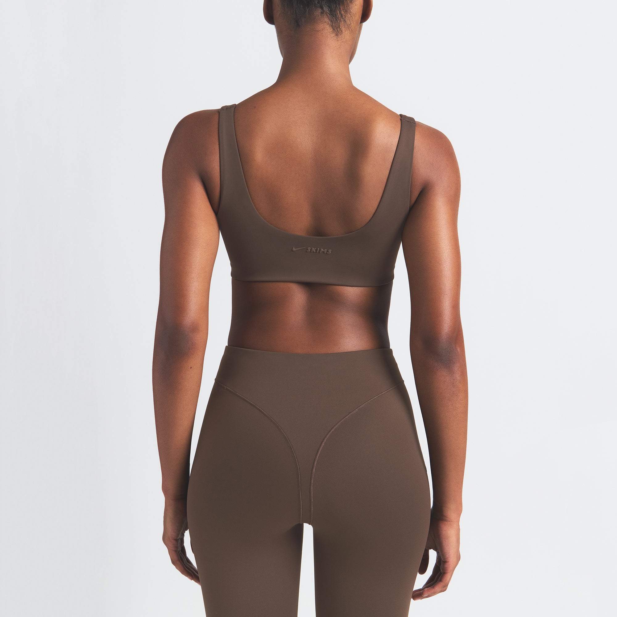 NikeSKIMS MATTE V-LINE 26" LEGGING | DARK SEPIA ON A MODEL BACK VIEW
