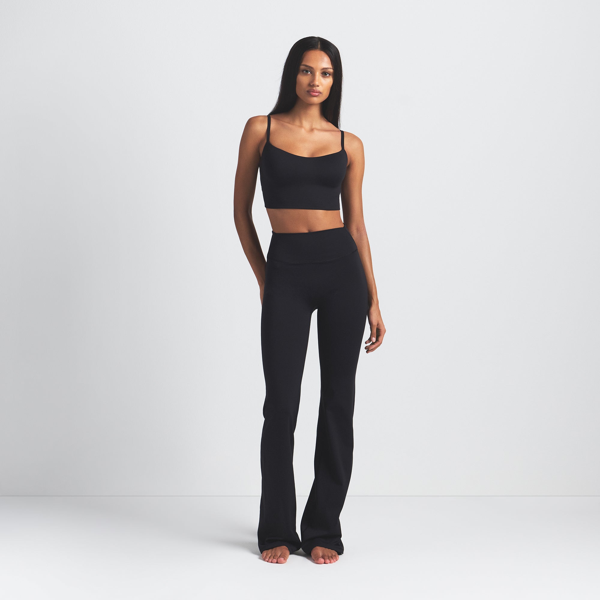 NikeSKIMS MATTE SLIM FLARE LEGGING | OBSIDIAN ON A MODEL FRONT VIEW
