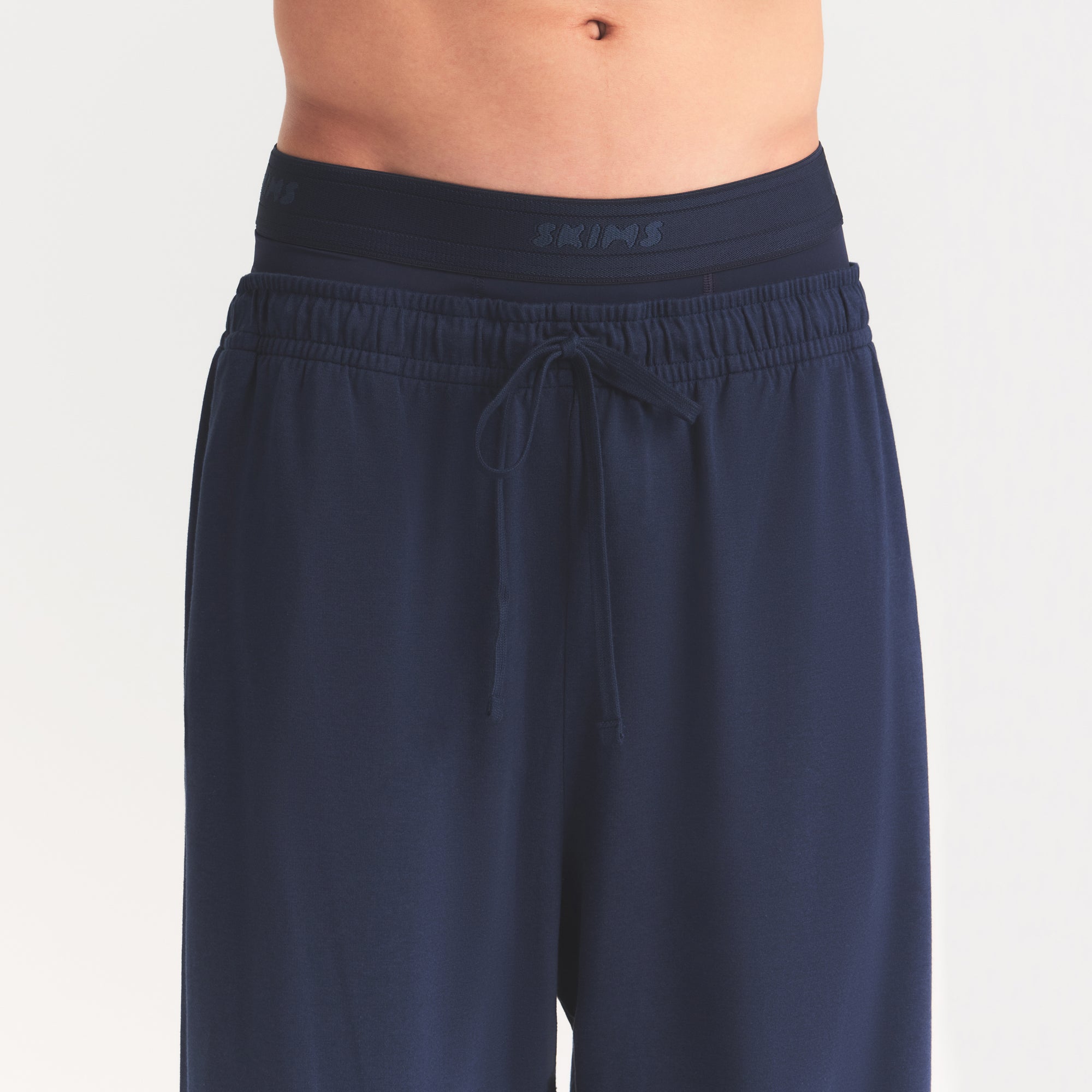 JERSEY LOUNGE MENS RELAXED STRAIGHT LEG PANT | NAVY ON A MODEL SIDE VIEW @ | FOCUS: 0.0, 1.0, 0.9