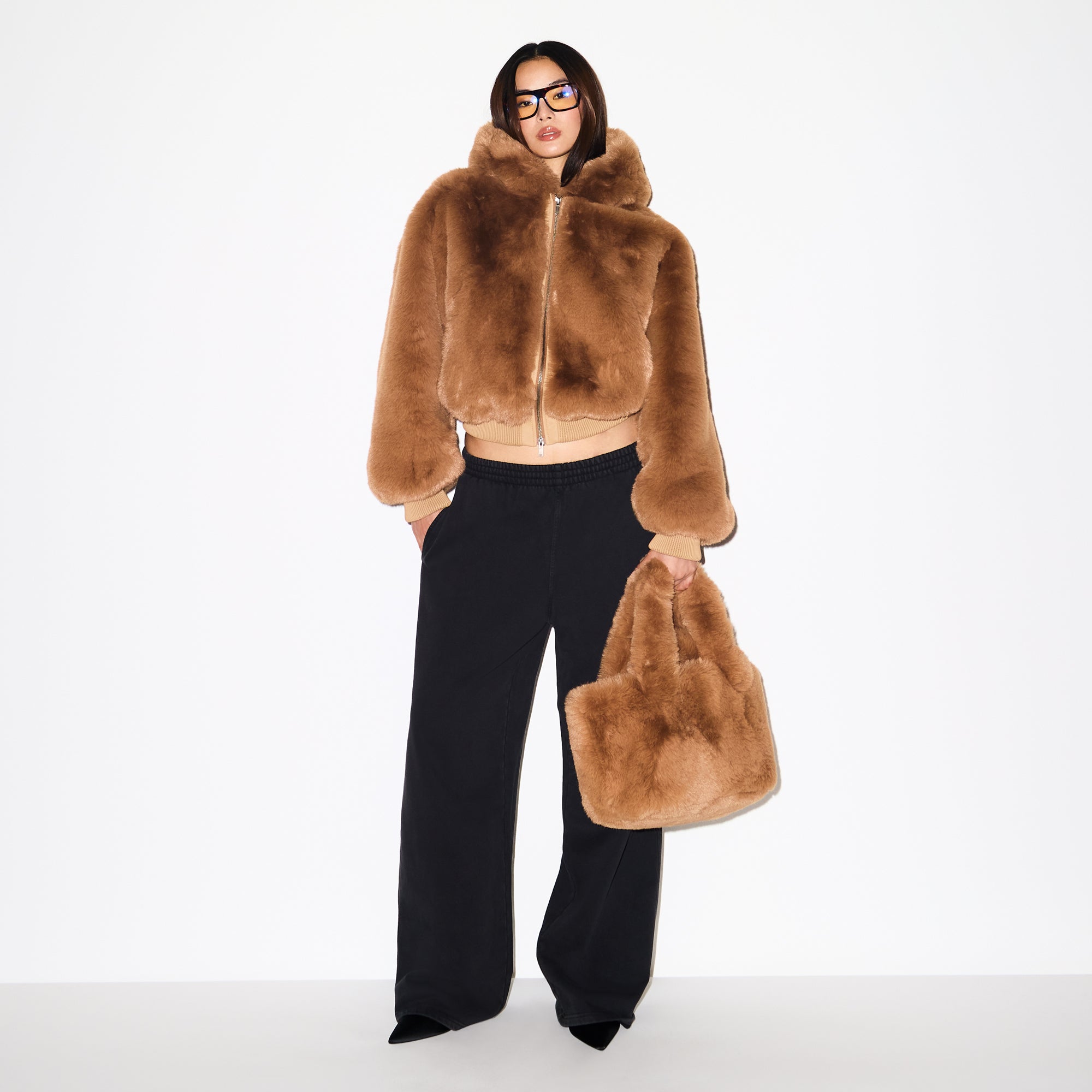 FAUX FUR MINI TOTE | CAMEL ON A MODEL FRONT VIEW @ | FOCUS: 0.0, 1.0, 0.9