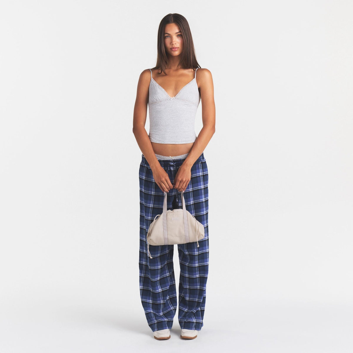MINI NYLON DRAWSTRING BAG | STONE ON MODEL | FOCUS: 0.0, 1.0, 0.9