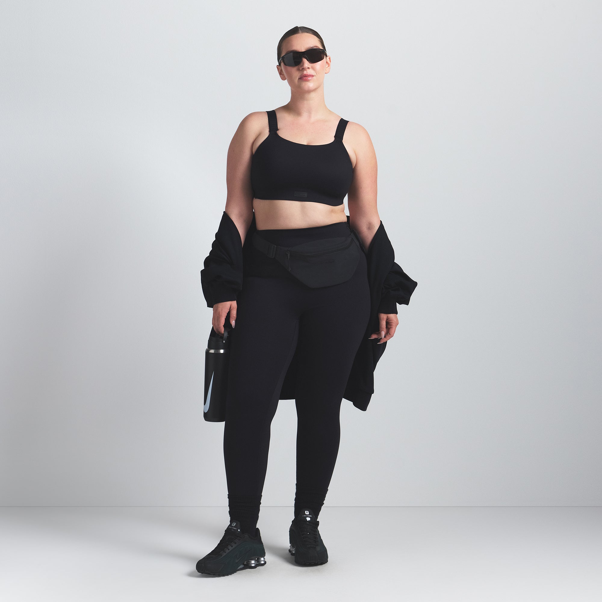 NikeSKIMS MATTE WIDE STRAP BRA | OBSIDIAN ON A MODEL FRONT VIEW