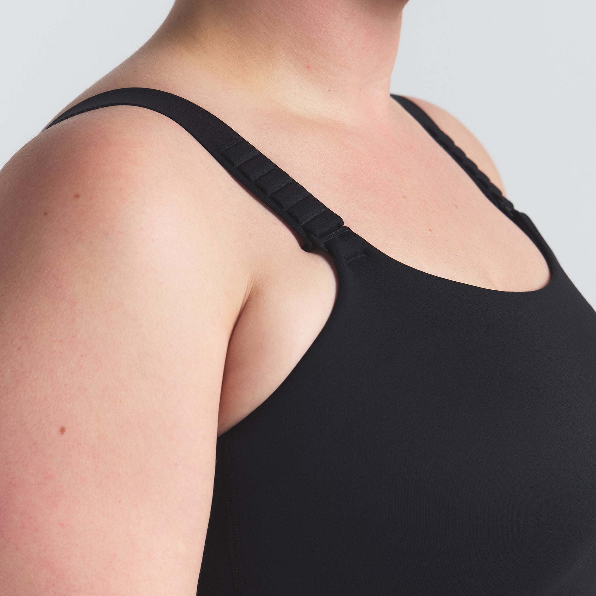 NikeSKIMS MATTE WIDE STRAP BRA | OBSIDIAN ON A MODEL SIDE VIEW