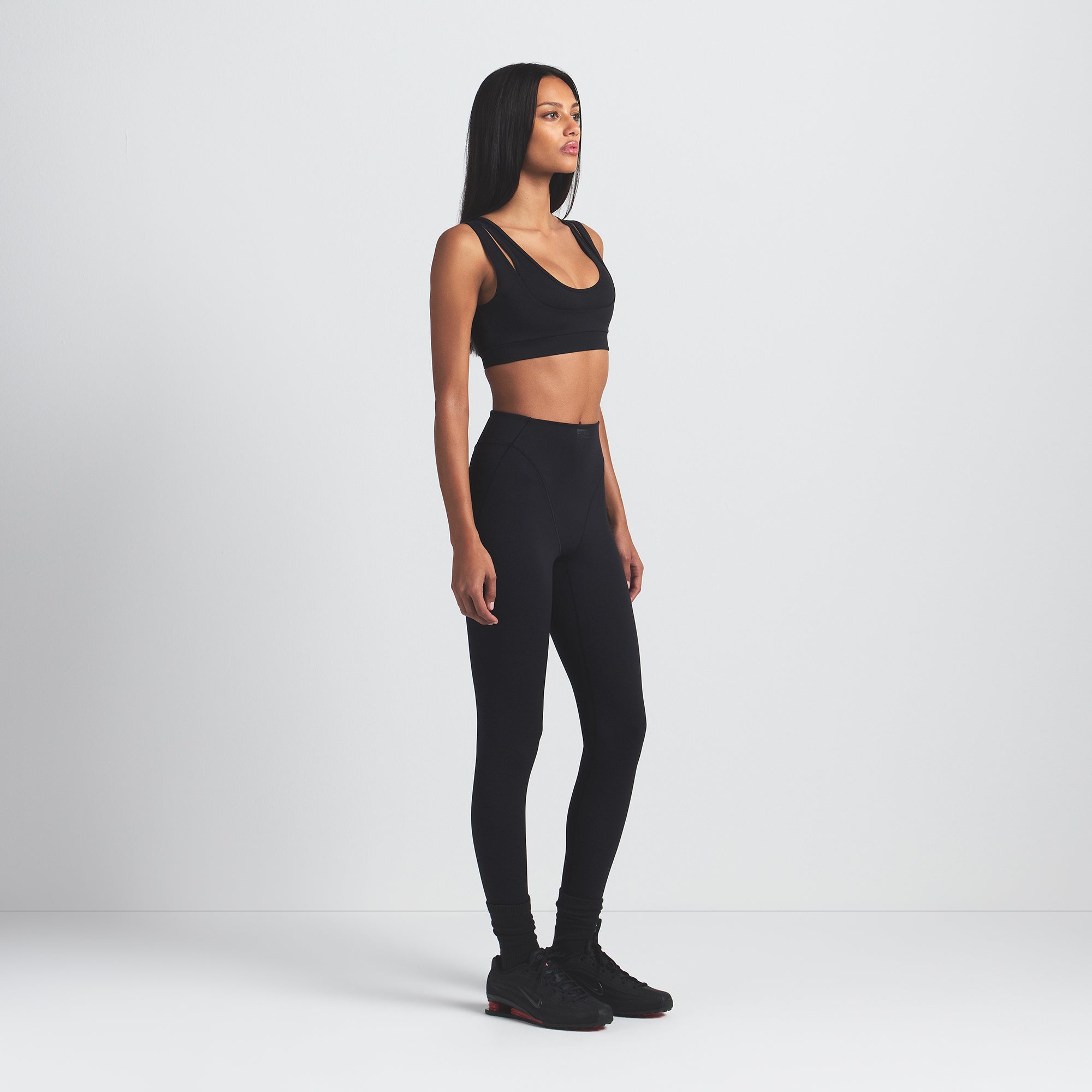 NikeSKIMS MATTE DOUBLE STRAP SCOOP BRA | OBSIDIAN ON A MODEL SIDE VIEW