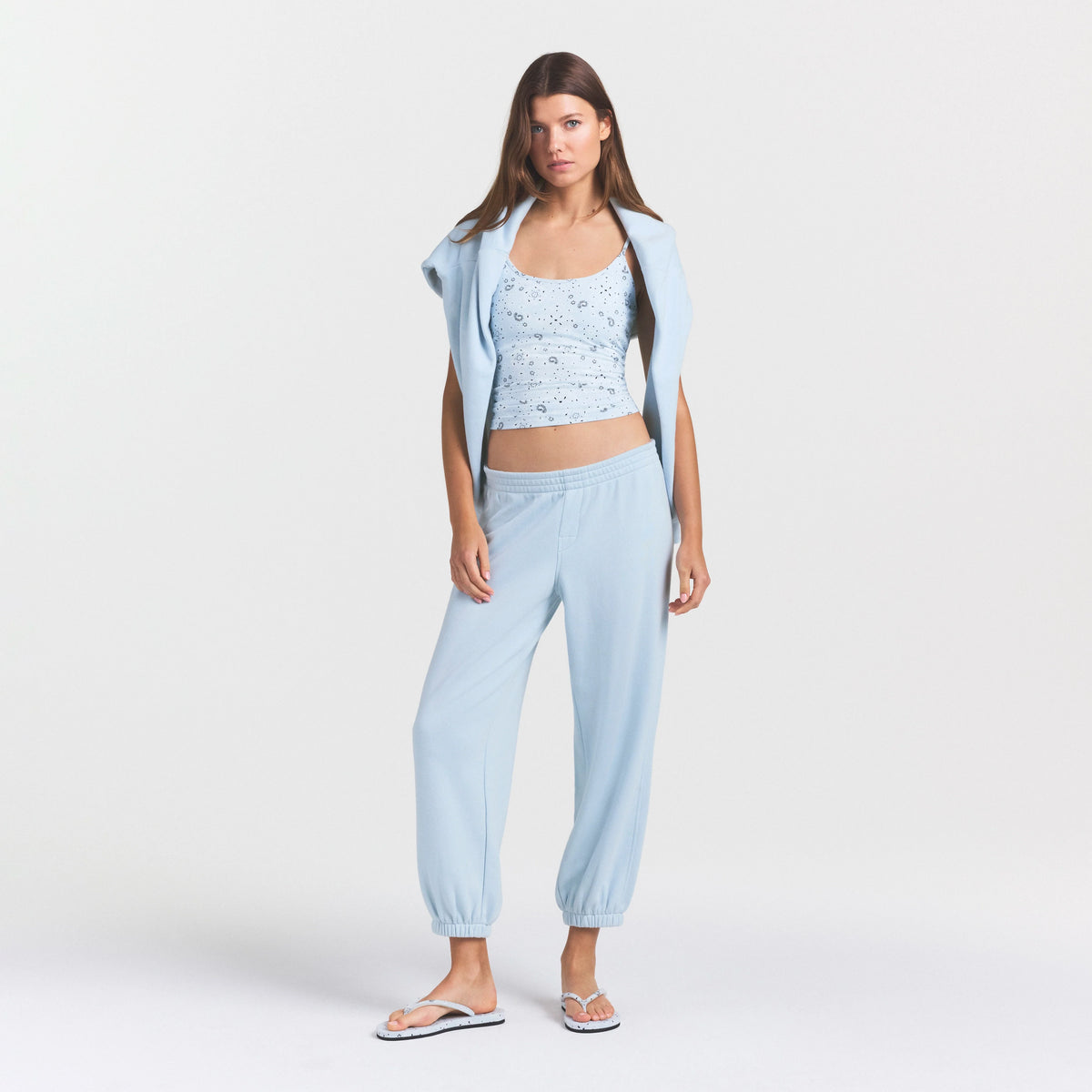DRAPEY FRENCH TERRY CROPPED JOGGER | POWDER BLUE ON A MODEL FRONT VIEW @ | FOCUS: 0.0, 1.0, 0.9