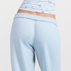 DRAPEY FRENCH TERRY CROPPED JOGGER | POWDER BLUE ON A MODEL SIDE VIEW @ | FOCUS: 0.0, 1.0, 0.9