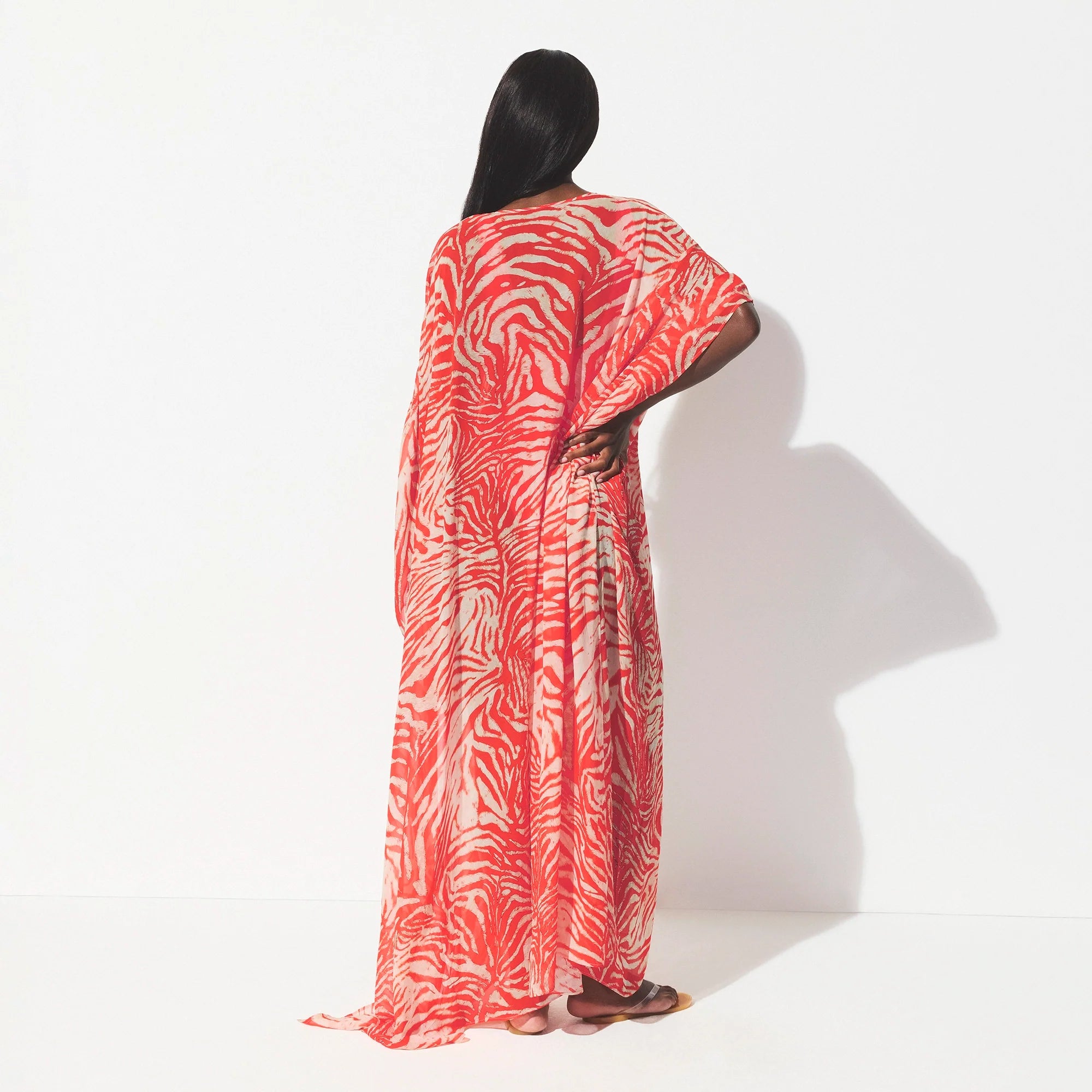 SHEER COVER-UPS LONG KAFTAN | CARMINE ZEBRA PRINT ON A MODEL SIDE VIEW @ | FOCUS: 0.0, 1.0, 0.9