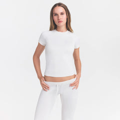 NikeSKIMS AIRY BABY TEE | IVORY ON A MODEL