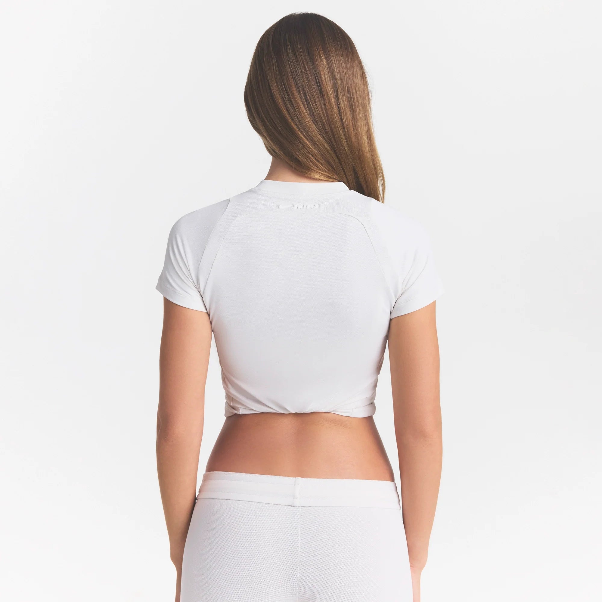 NikeSKIMS AIRY BABY TEE | IVORY ON A MODEL
