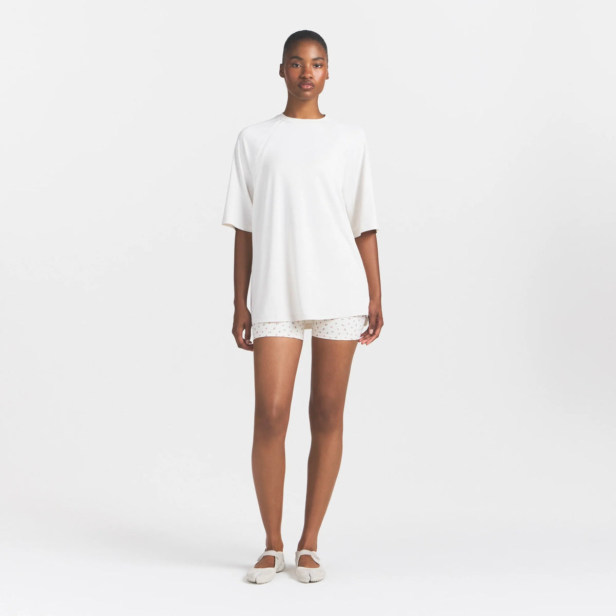 NikeSKIMS AIRY OVERSIZED TEE | IVORY ON A MODEL