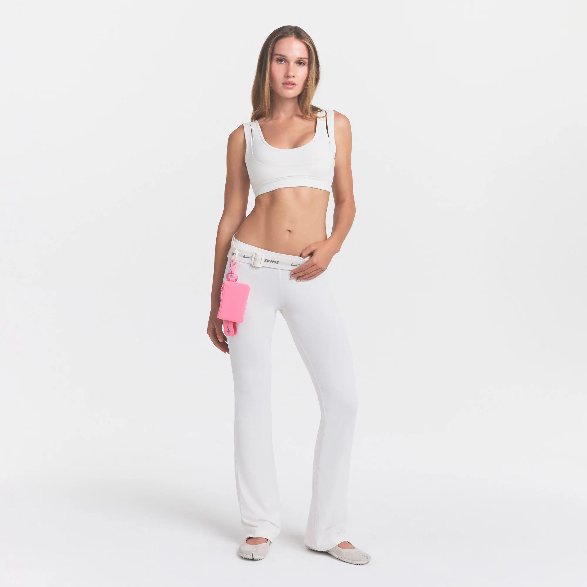 NikeSKIMS AIRY LOW RISE MINI FLARE PANT | IVORY ON A MODEL