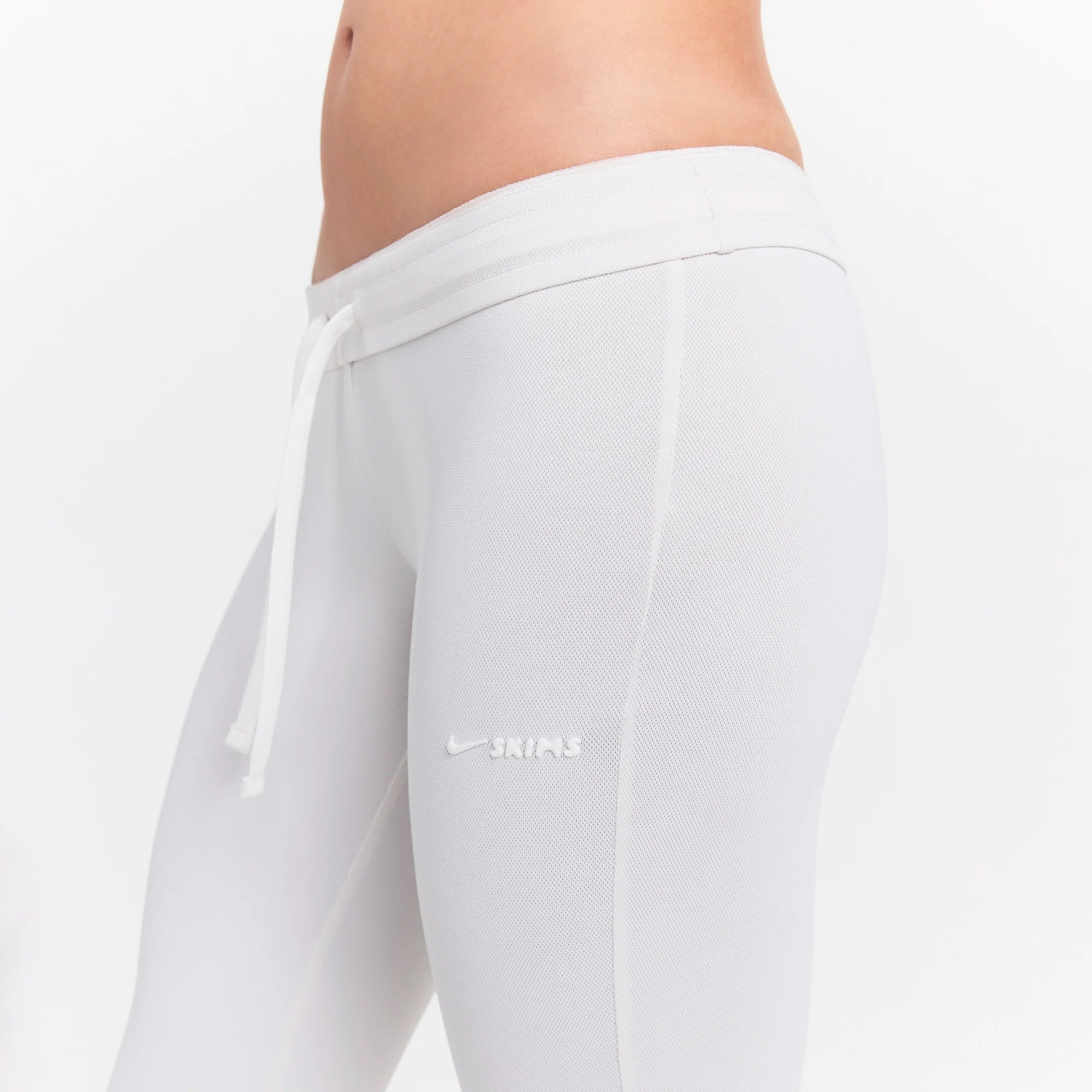NikeSKIMS AIRY LOW RISE MINI FLARE PANT | IVORY ON A MODEL