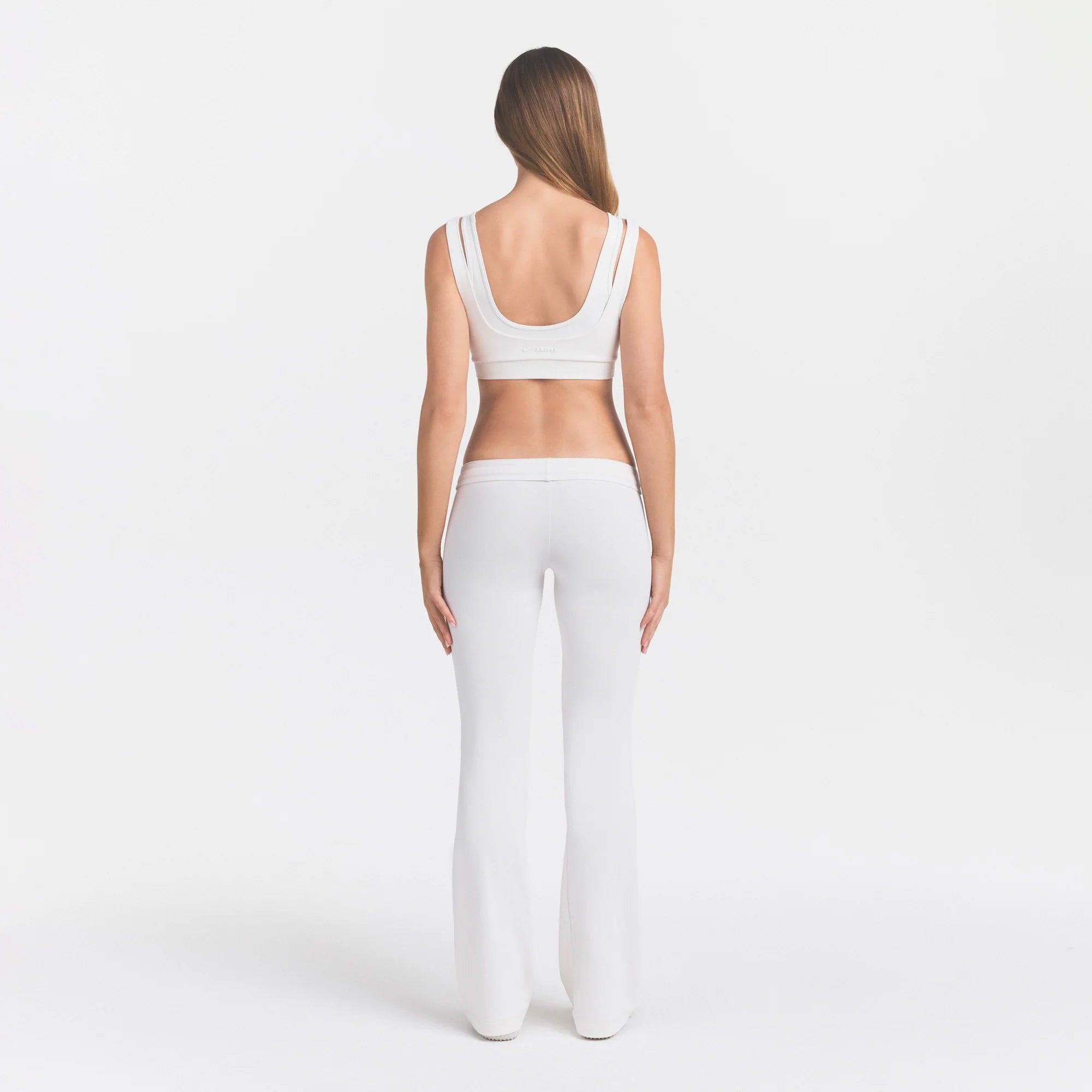 NikeSKIMS AIRY LOW RISE MINI FLARE PANT | IVORY ON A MODEL