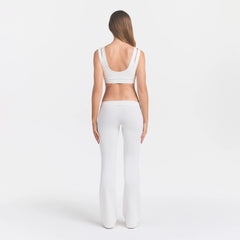NikeSKIMS AIRY LOW RISE MINI FLARE PANT | IVORY ON A MODEL