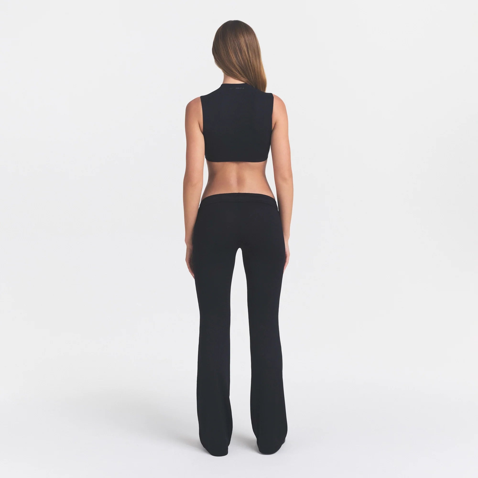 NikeSKIMS AIRY LOW RISE MINI FLARE PANT | NSKM OBSIDIAN ON A MODEL