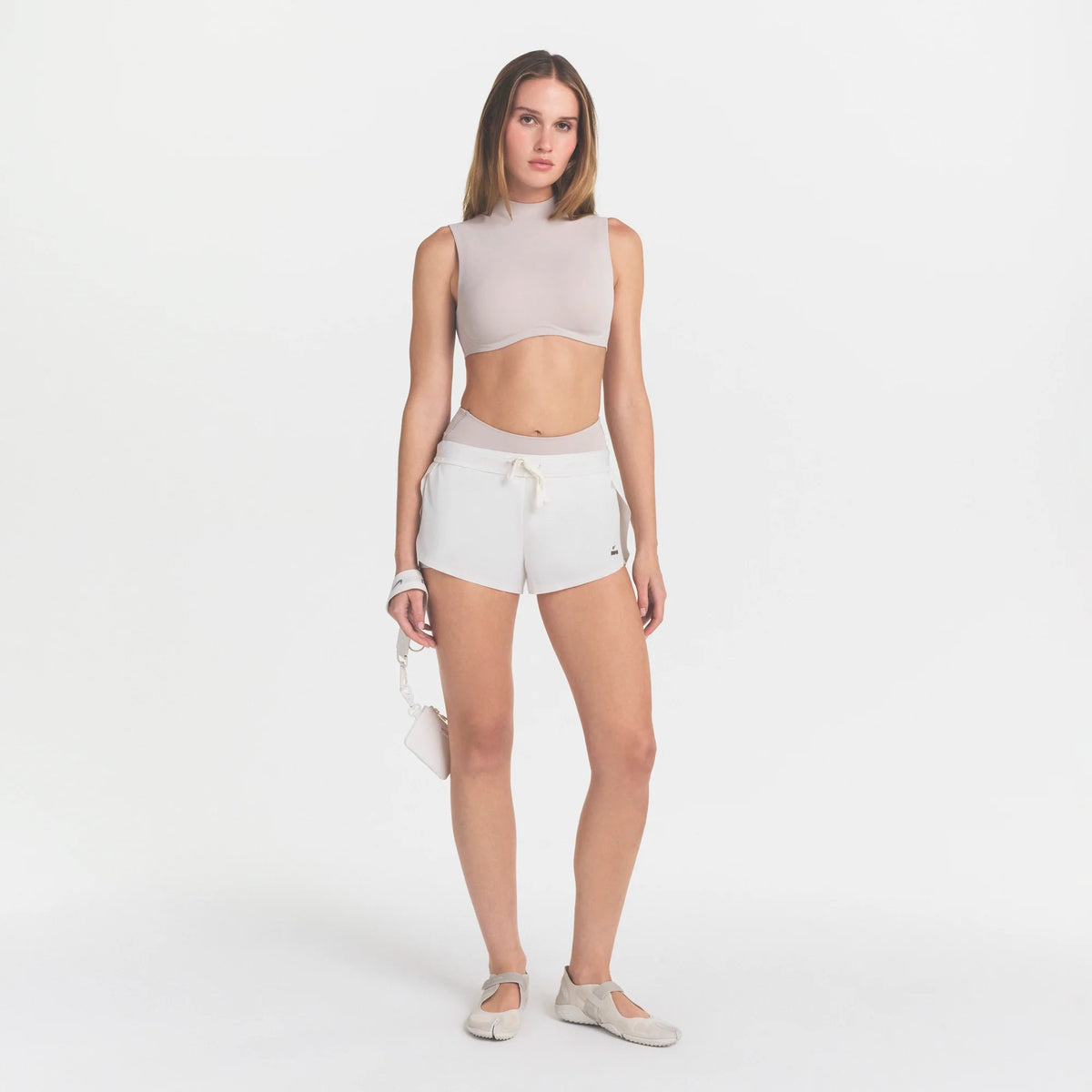 NikeSKIMS STUDIO STRETCH MOCK NECK BRA | LINENON A MODEL FRONT