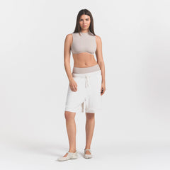 NikeSKIMS AIRY RELAXED SHORT | IVORY ON A MODEL
