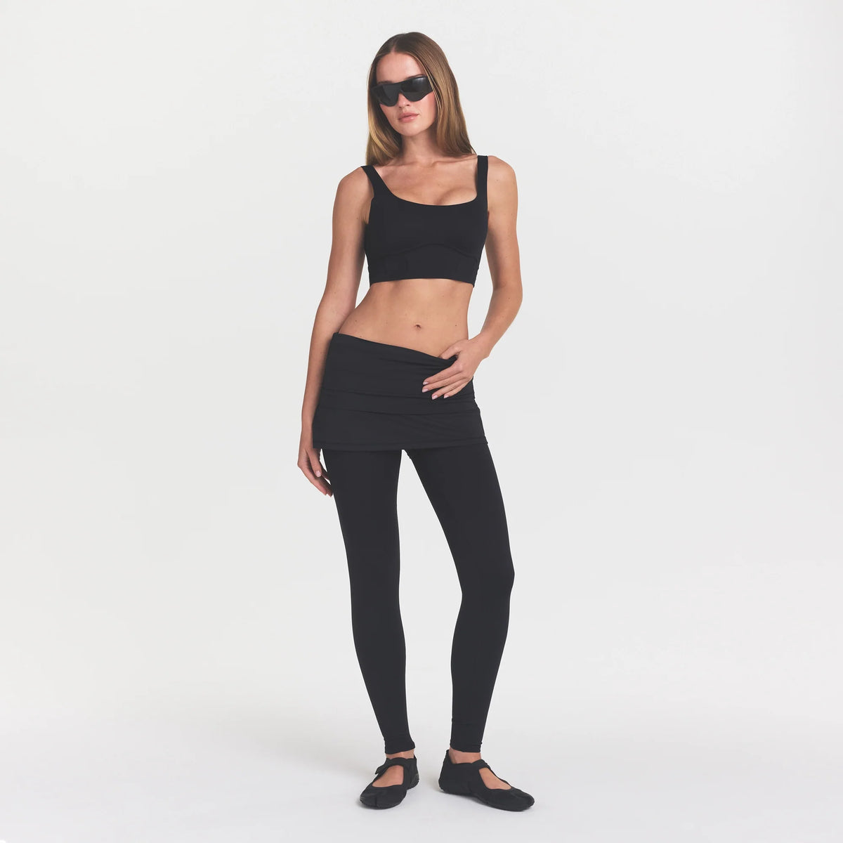 NikeSKIMS MATTE CORSET LONGLINE BRA | OBSIDIAN ON A MODEL