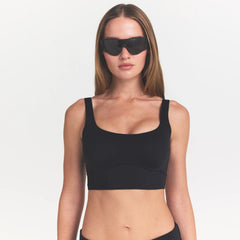 NikeSKIMS MATTE CORSET LONGLINE BRA | OBSIDIAN ON A MODEL