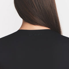 NikeSKIMS MATTE CORSET CROP TOP | OBSIDIAN ON A MODEL