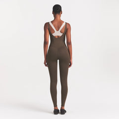NikeSKIMS MATTE CORSET 29" ONE PIECE | DARK SEPIA ON A MODEL