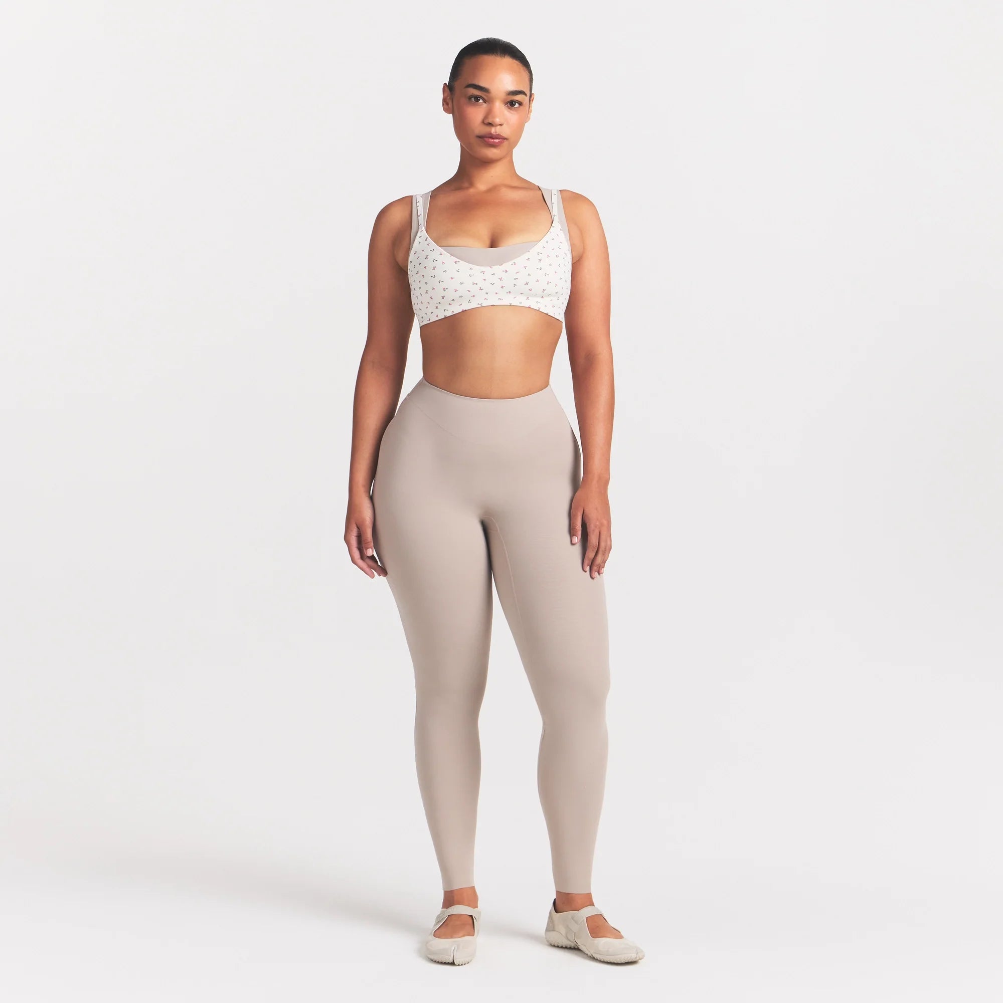NikeSKIMS MATTE MICRO SCOOP BRA | DITSY FLORAL PRINT ON A MODEL