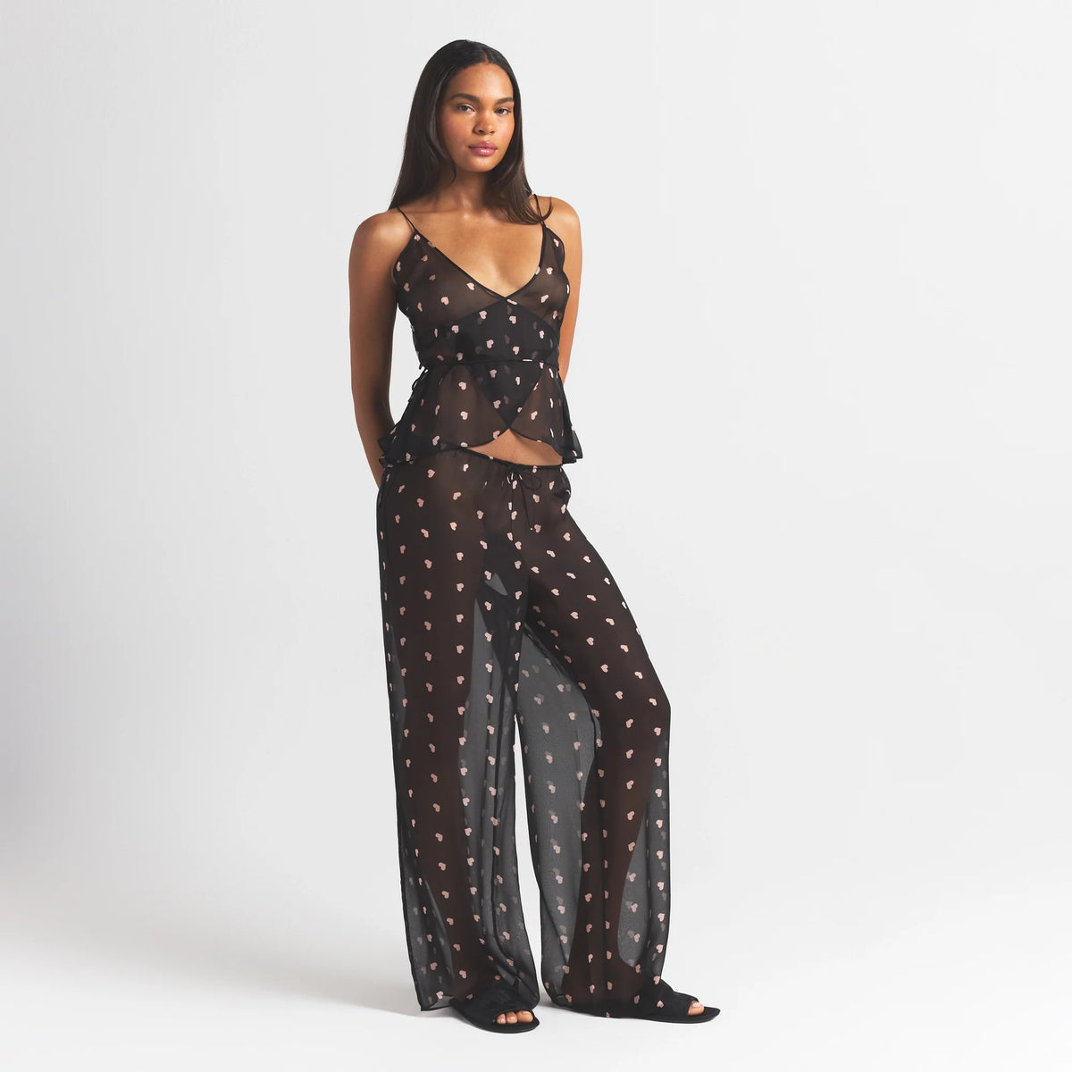 SKIMS ROMANCE WRAP CAMI TOP | OBSIDIAN SPACED HEARTS ON A MODEL FRONT VIEW @ | FOCUS: 0.0, 1.0, 0.9