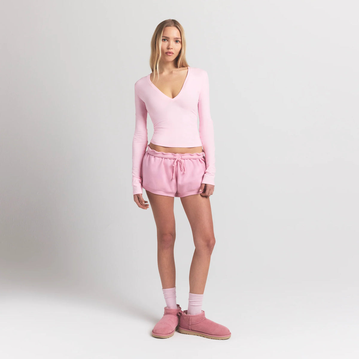COTTON JERSEY LONG SLEEVE DEEP PLUNGE TOP | CHERRY BLOSSOM ON A MODEL FRONT VIEW S | FOCUS: 0.0, 1.0, 0.9