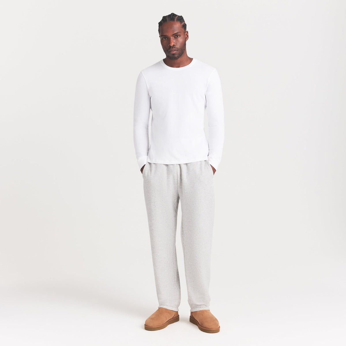 SKIMS COTTON MENS CLASSIC LONG SLEEVE T-SHIRT | CHALK ON A MODEL SIDE VIEW | FOCUS: 0.0, 1.0, 0.9