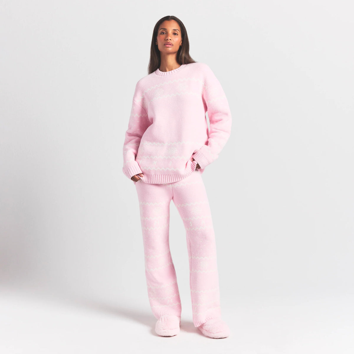 COZY LIGHT CREWNECK PULLOVER | BABY PINK HEART FAIR ISLE ON A MODEL FRONT VIEW @ | FOCUS: 0.0, 1.0, 0.9