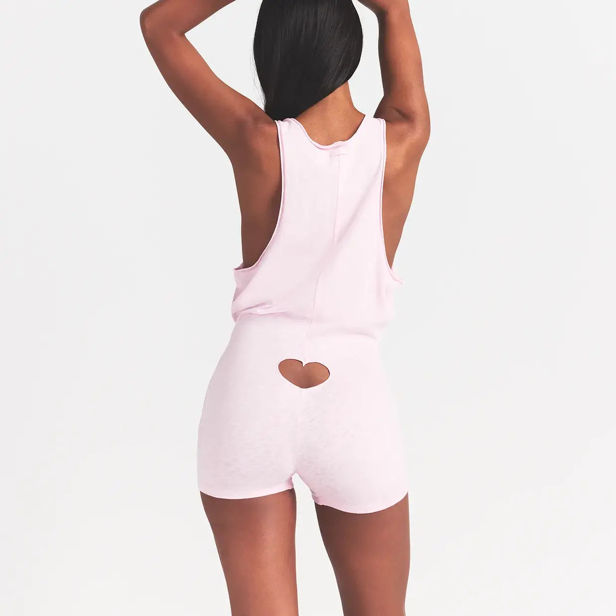 WORN IN JERSEY HEART ONESIE | BABY PINK ON A MODEL BACK VIEW @ | FOCUS: 0.0, 1.0, 0.9