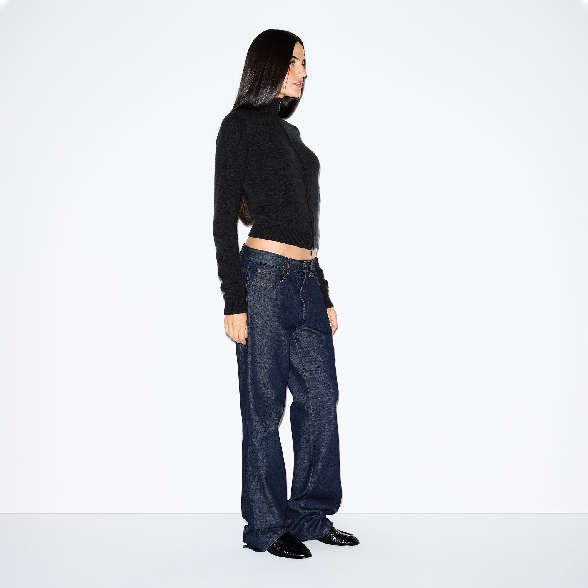 WOOL CASHMERE ZIP UP MOCK NECK SWEATER | ONYX ON A MODEL SIDE VIEW @ | FOCUS: 0.0, 1.0, 0.9