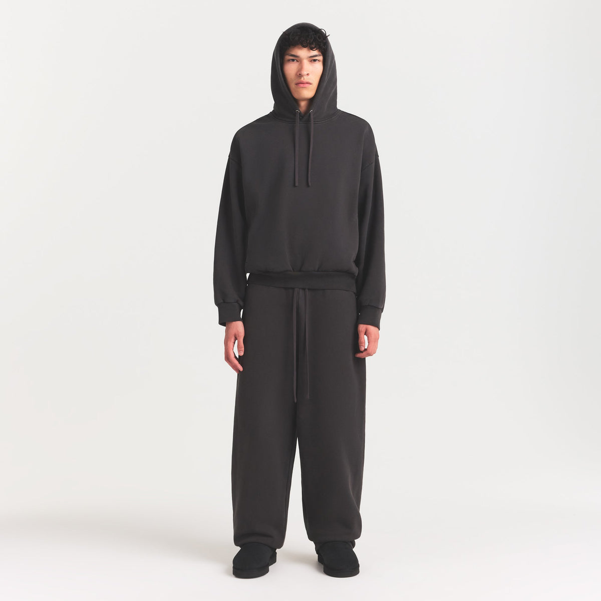 HEAVYWEIGHT FLEECE MENS HOODIE | WASHED ONYX ON A MODEL FRONT VIEW @ | FOCUS: 0.0, 1.0, 0.9