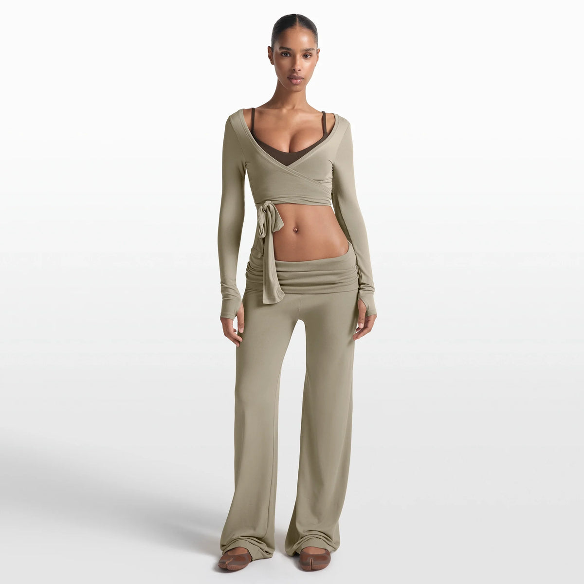 NikeSKIMS STRETCH KNIT FOLDOVER WIDE LEG PANT | DUNE ON A MODEL FRONT VIEW @ | FOCUS: 0.0, 1.0, 0.9