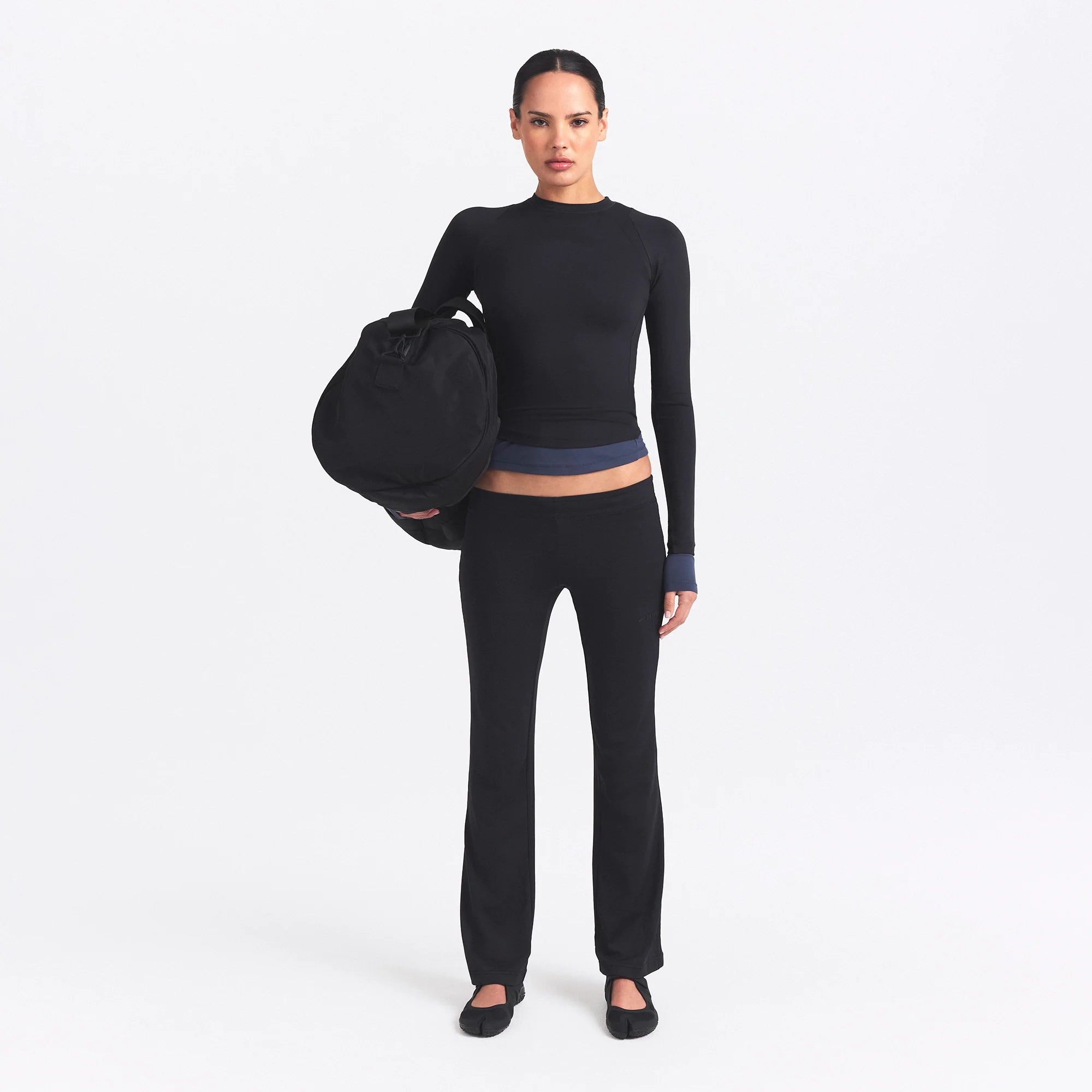 NikeSKIMS AIRY STRAIGHT LEG PANT | OBSIDIAN ON A MODEL FRONT VIEW @ | FOCUS: 0.0, 1.0, 0.9