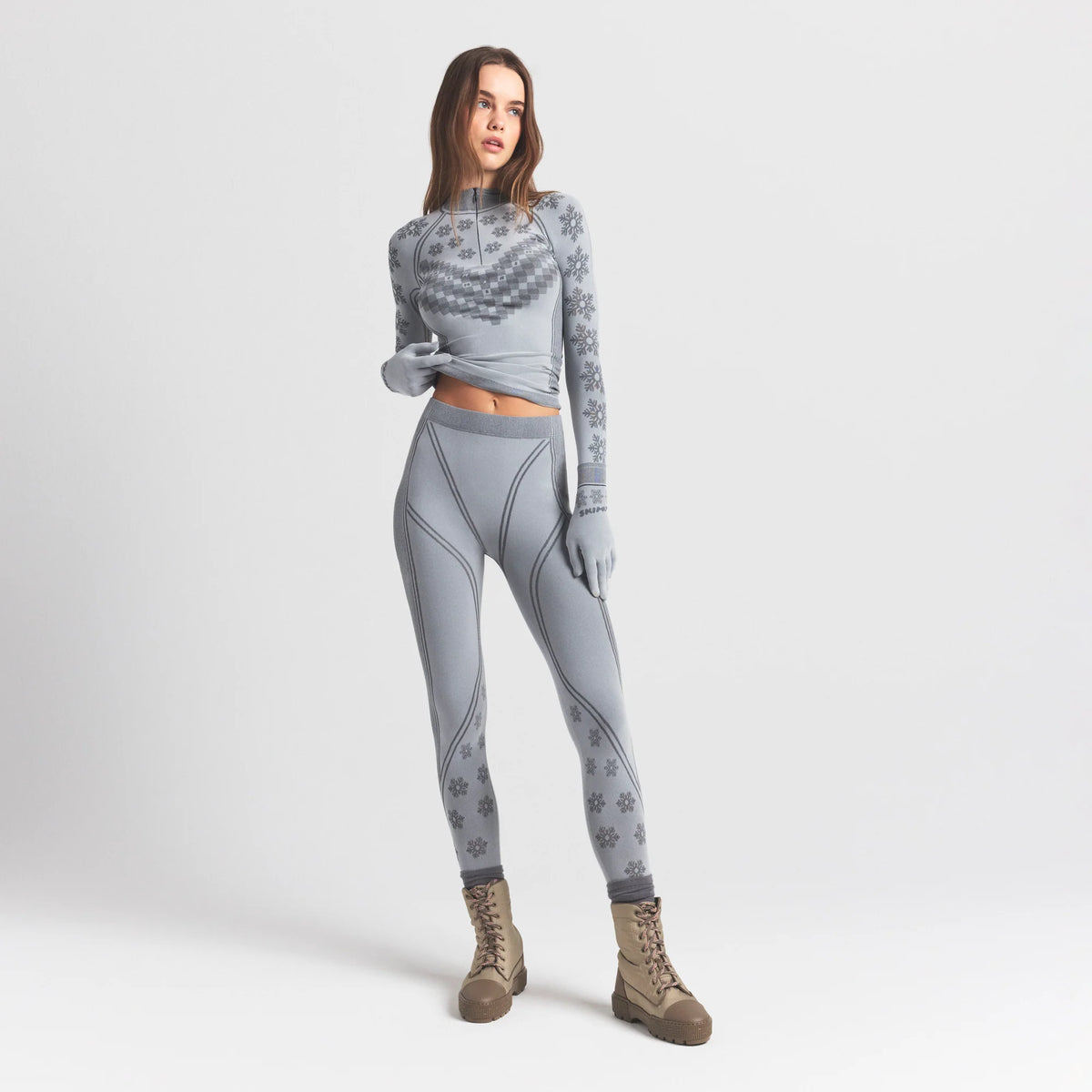SKIMS FIRST LAYERS LEGGING | MIRROR WINTER FAIR ISLE ON A MODEL FRONT VIEW @ | FOCUS: 0.0, 1.0, 0.9