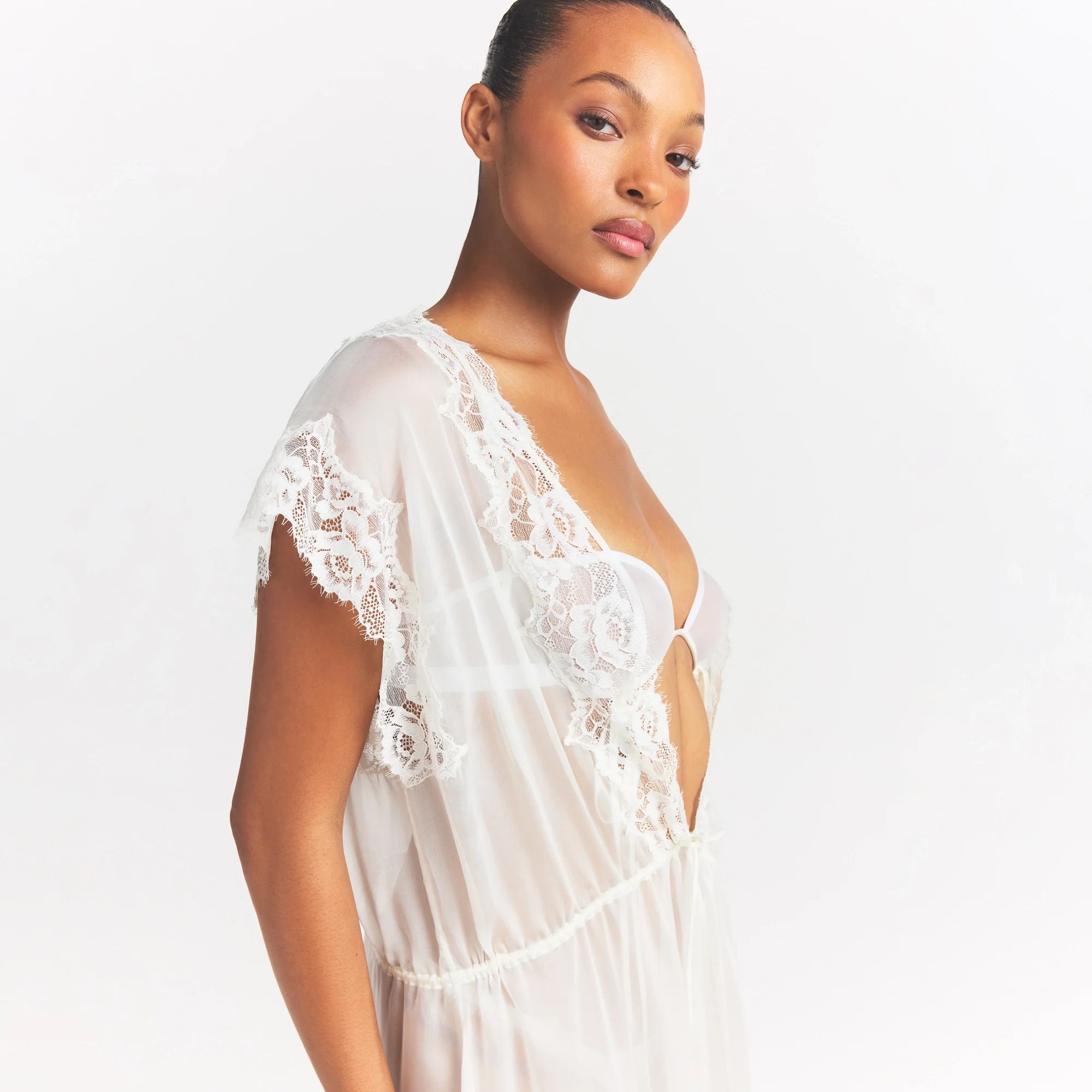 SKIMS ROMANCE LONG ROBE | IVORY ON A MODEL SIDE VIEW @ | FOCUS: 0.0, 1.0, 0.9