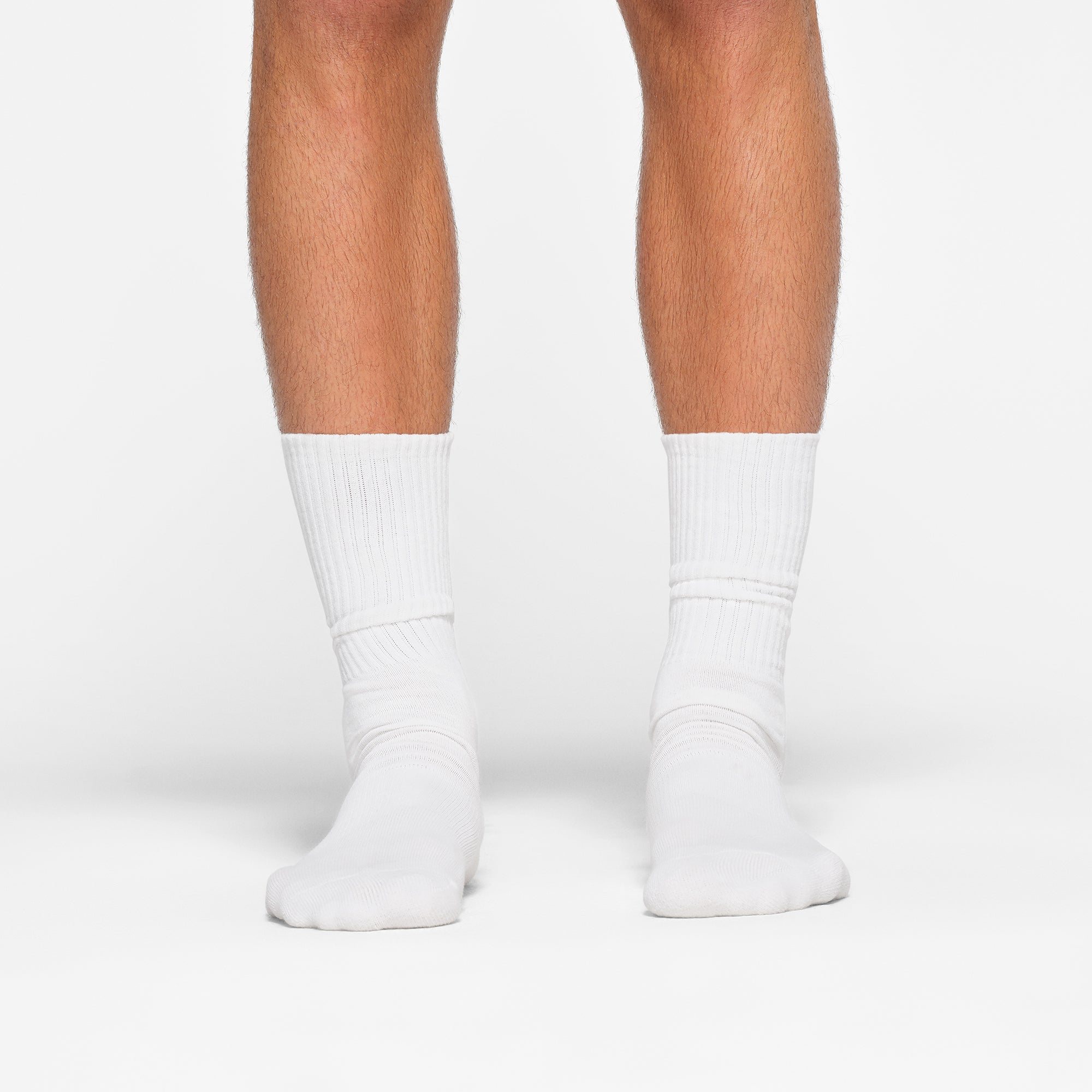 MENS TUBE CREW SOCK 3-PACK WORN BY A MODEL IN FRONT VIEW