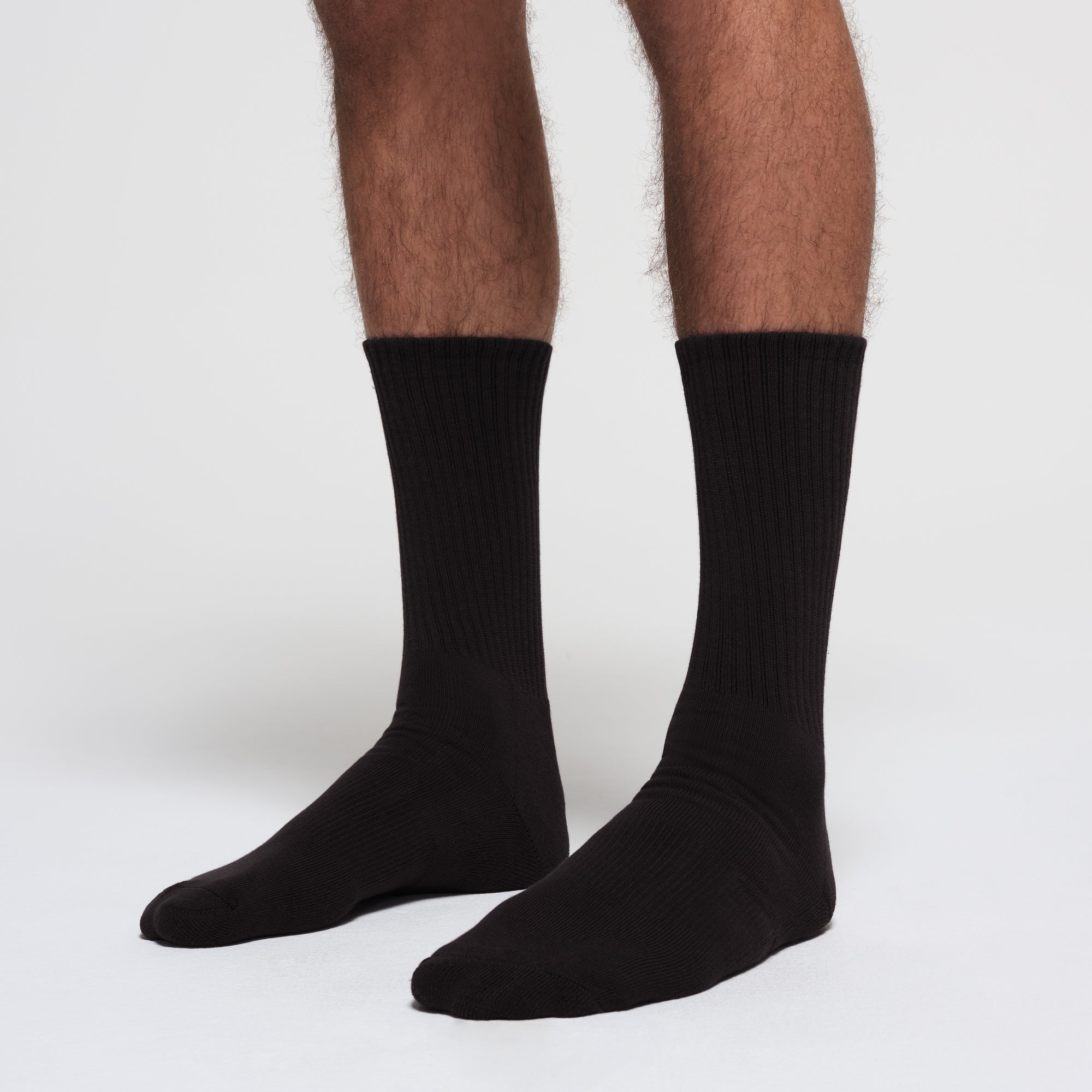 MENS TUBE CREW SOCK 3-PACK | ONYX ON A MODEL SIDE VIEW