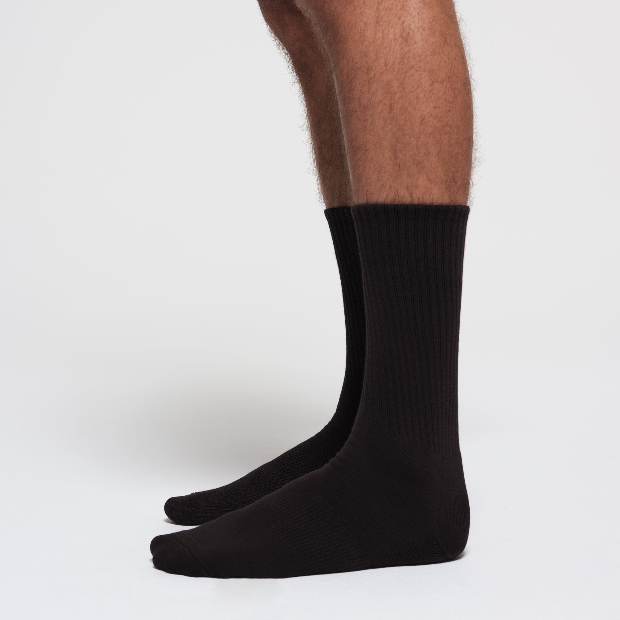 MENS TUBE CREW SOCK 3-PACK | ONYX ON A MODEL SIDE VIEW