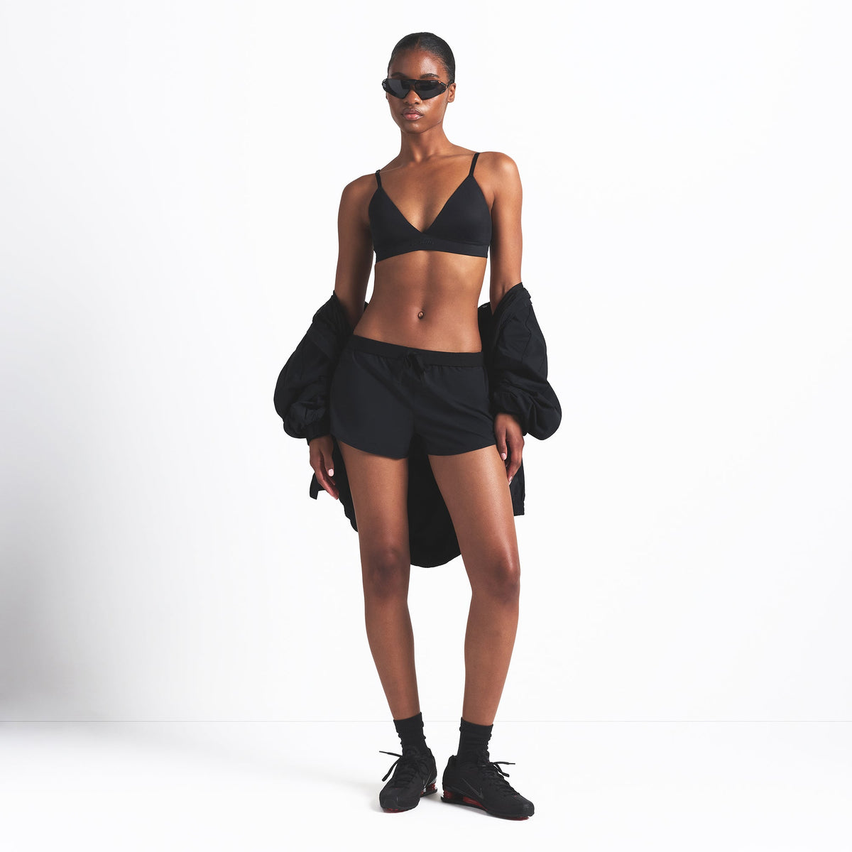 NikeSKIMS WOVEN NYLON 2.5" RUNNER SHORT | OBSIDIAN ON A MODEL FRONT VIEW @ | FOCUS: 0.0, 1.0, 0.9