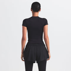 NikeSKIMS AIRY MINI SHORT | OBSIDIAN ON A MODEL BACK VIEW @ | FOCUS: 0.9, 0.1, 0.7