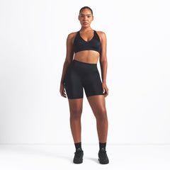 NikeSKIMS SHINE BONDED WAIST 5" BIKER SHORT | OBSIDIAN ON A MODEL FRONT VIEW @ | FOCUS: 0.9, 0.1, 0.7