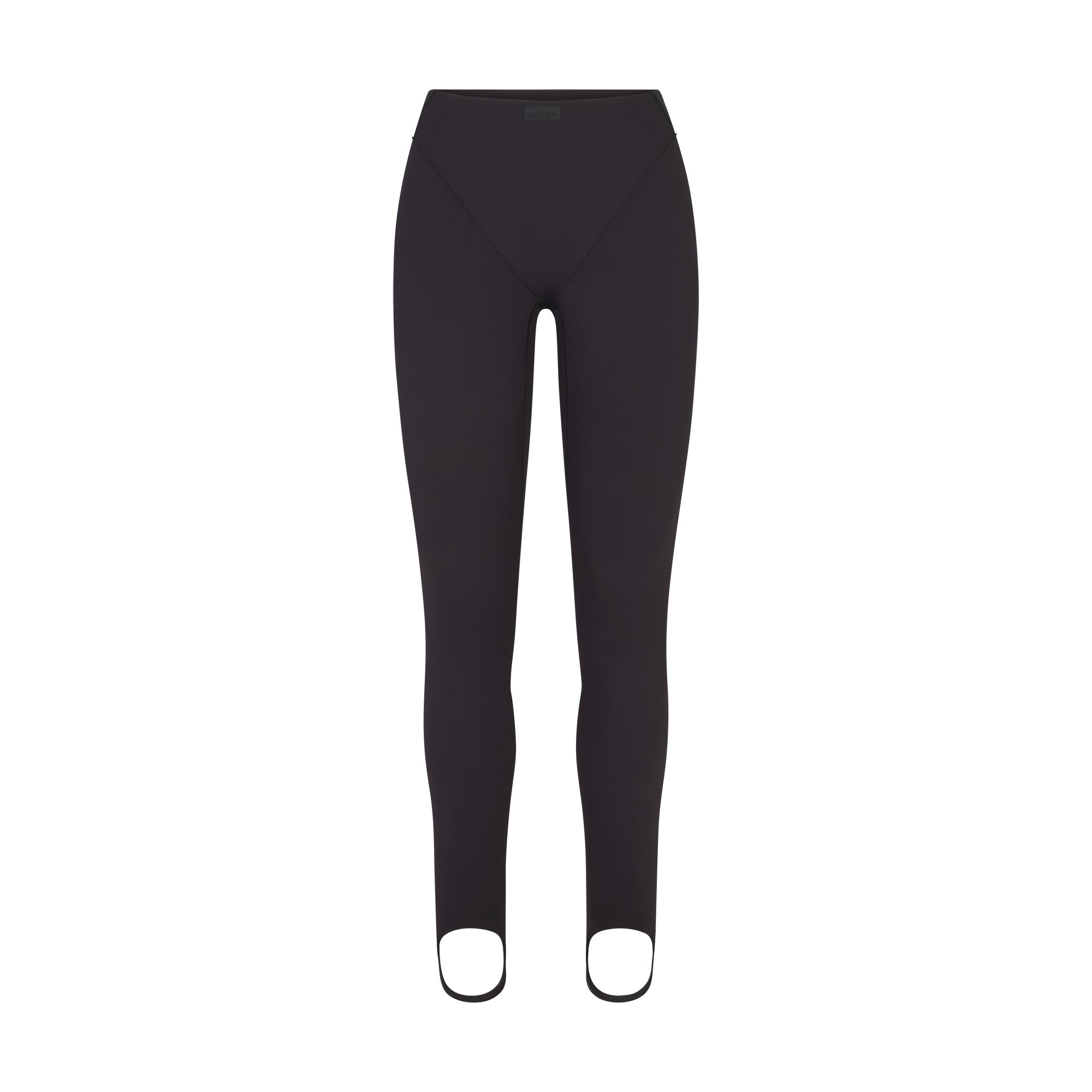 NikeSKIMS MATTE V-LINE STIRRUP LEGGING | OBSIDIAN FLAT ON A WHITE BACKGROUND | FLT