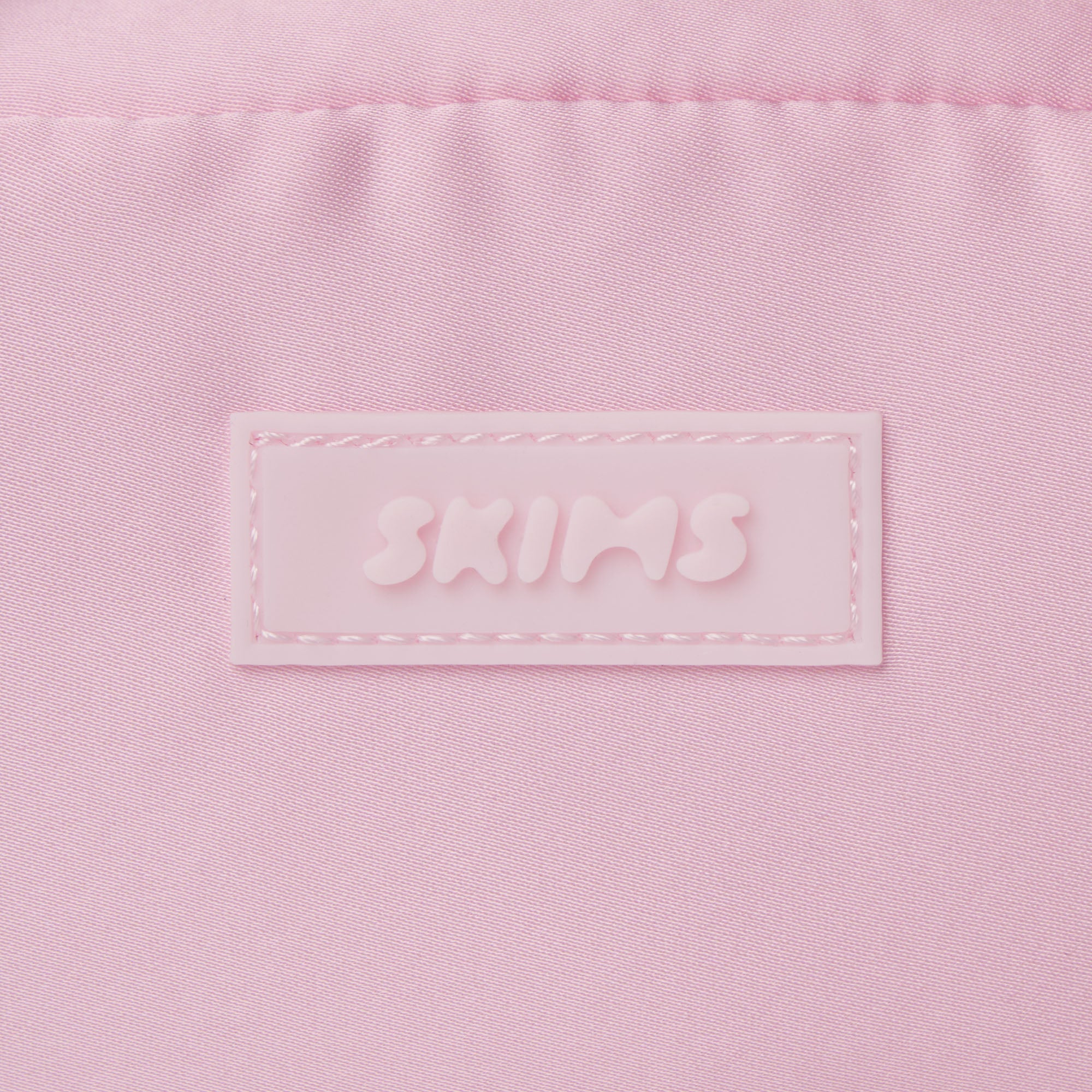 SKIMS ACCESSORIES SATIN MINI DUFFLE BAG | PEONY ADDITIONAL FABRIC DETAILS