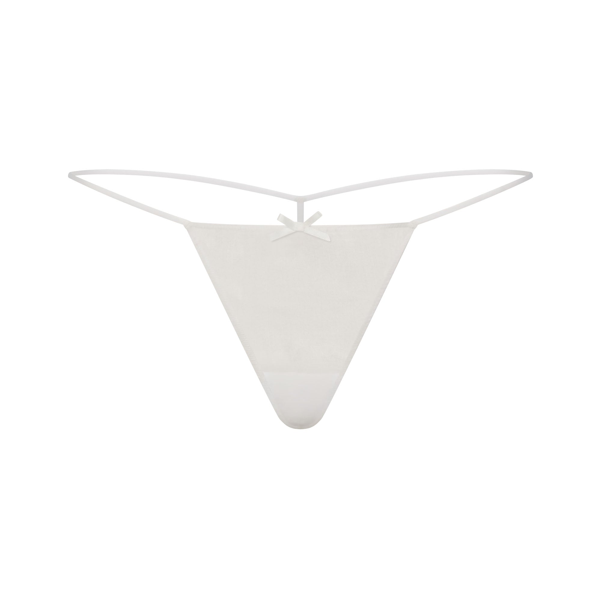 SKIMS ROMANCE BABYDOLL TOP AND STRING THONG SET | IVORY LAYS FLAT ON A WHITE BACKGROUND | FLT