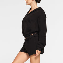 COTTON FLEECE CLASSIC ZIP UP HOODIE WORN BY A MODEL IN SIDE VIEW